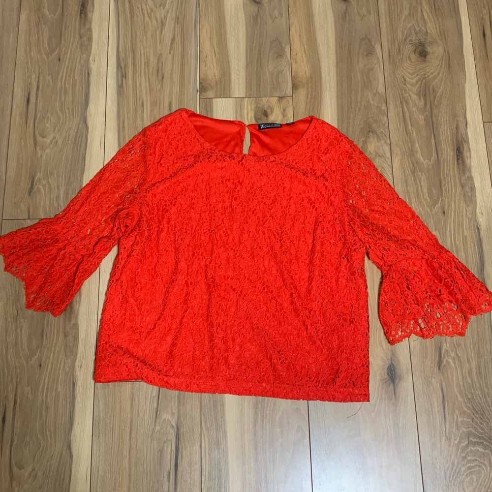 Red lace top with bell sleeves - perfect for a night out or a fancy event.